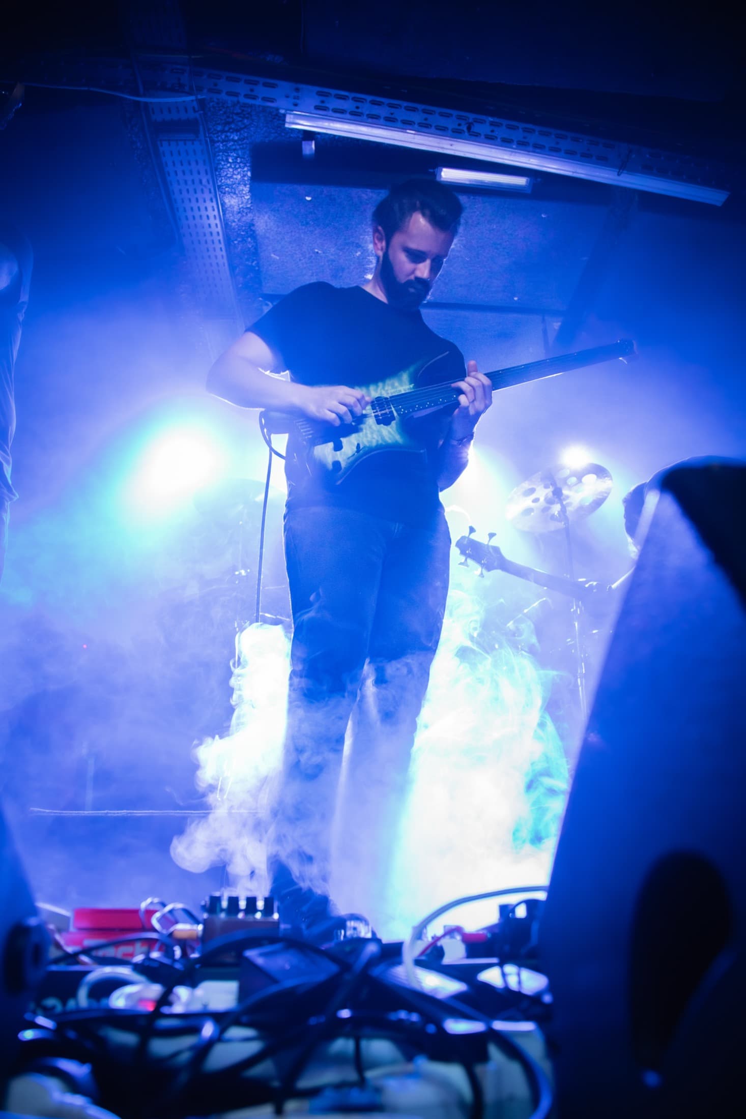 Vincent Chaudière surrounded by blue light and stage smoke.