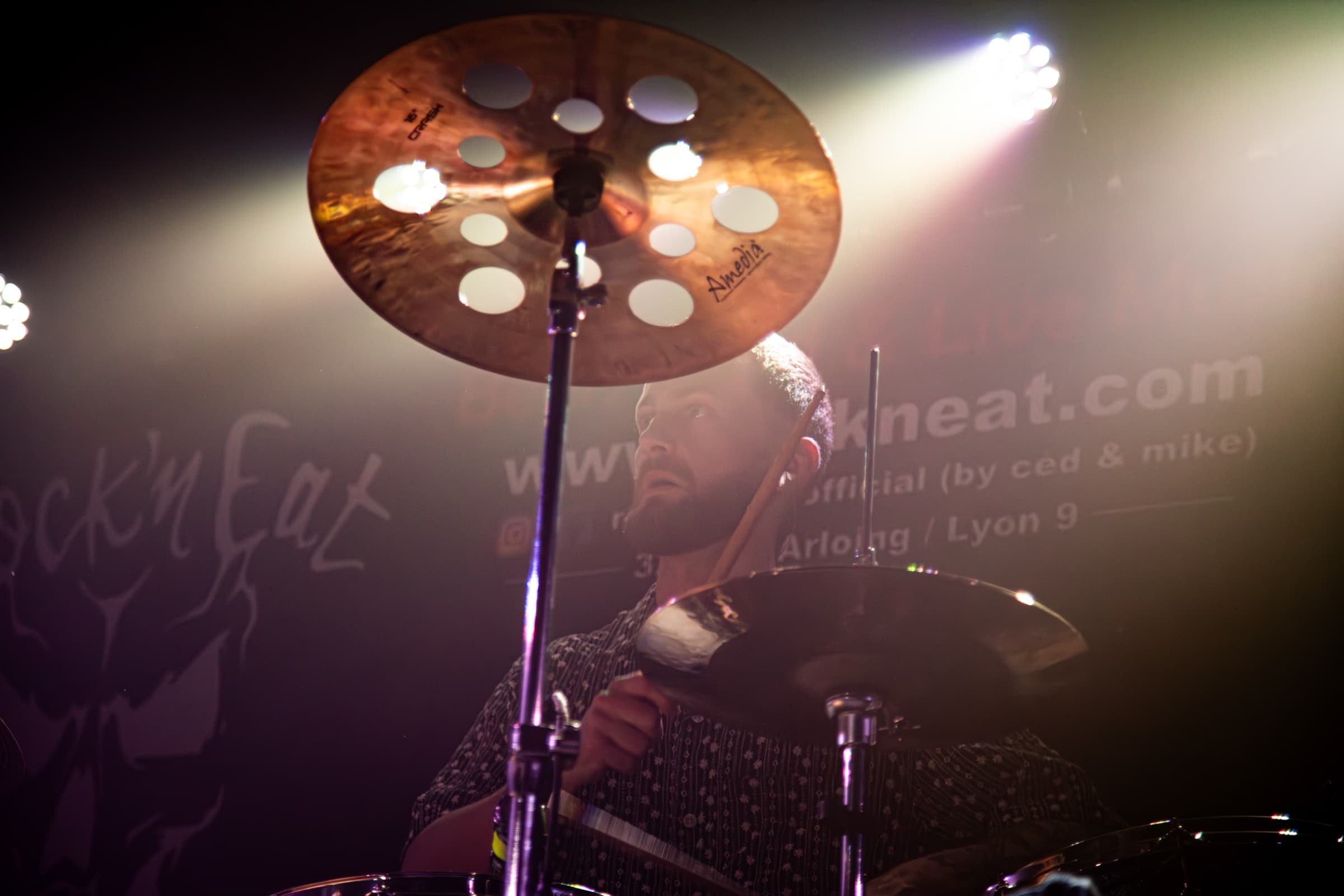 Benoît Durbet looking upward beneath a cymbal.